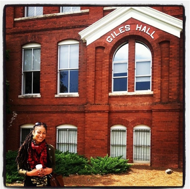 Author in front of college building