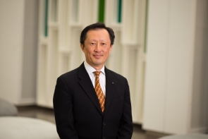 Smiling Asian man in suit and tie